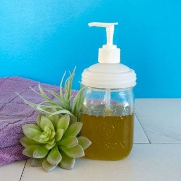 White pump on jar with soap and towels