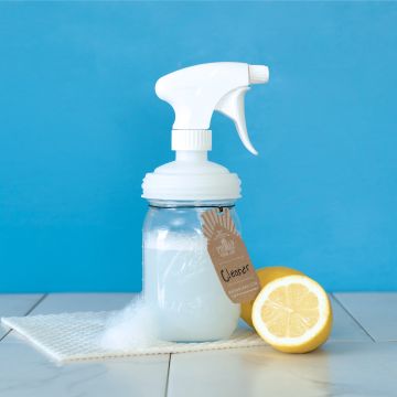 reCAP Sprayer top on Mason Jar with lemon and cleaning cloth **Mason Jar Not Included 